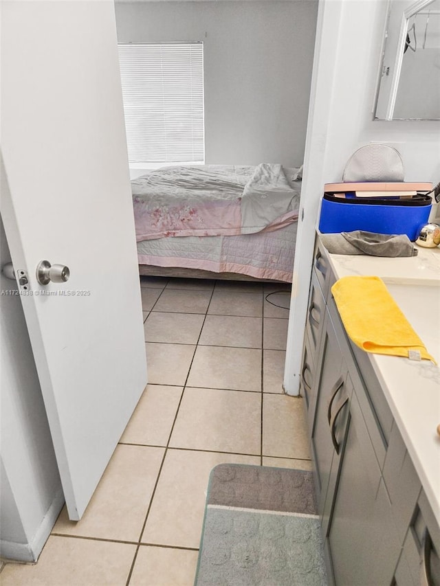 bedroom with light tile patterned flooring