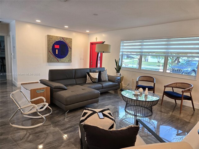 living room featuring a textured ceiling