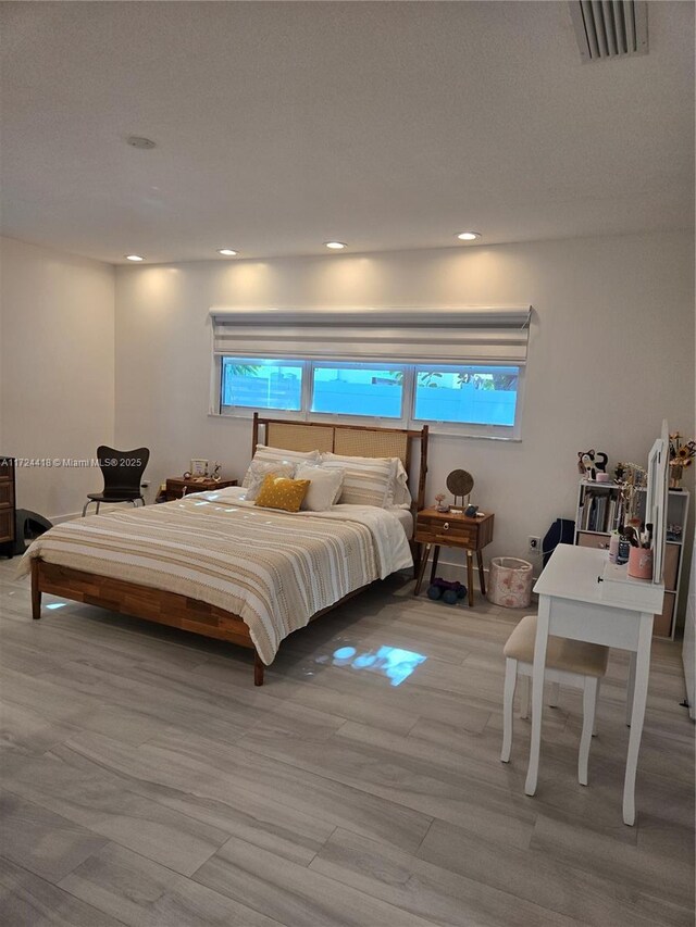 bedroom featuring light hardwood / wood-style floors