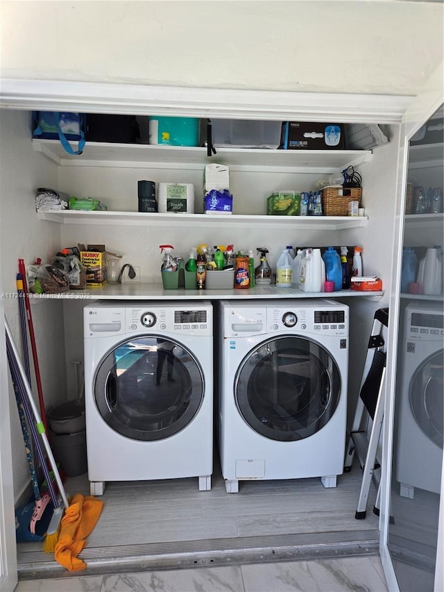 laundry room with washing machine and clothes dryer