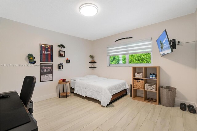 15100 SW 89th Ct, Palmetto Bay, FL 33176 - bedroom featuring baseboards and light wood-style flooring