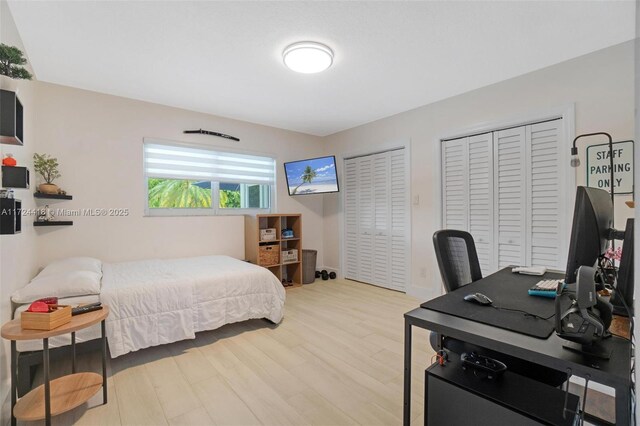 15100 SW 89th Ct, Palmetto Bay, FL 33176 - bedroom with multiple closets and wood finished floors