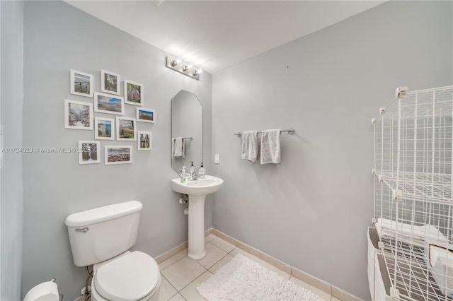 bathroom featuring tile patterned floors and toilet