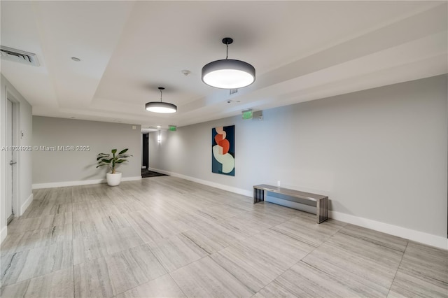 empty room with a tray ceiling