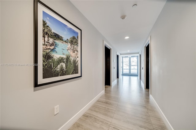 hallway with light tile patterned flooring