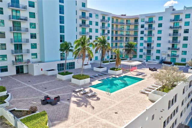 view of swimming pool with a patio area