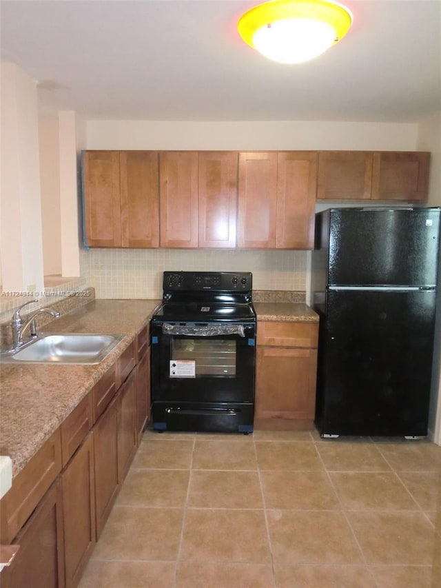 kitchen featuring sink and black appliances