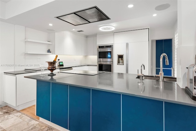 kitchen with open shelves, double oven, modern cabinets, and recessed lighting