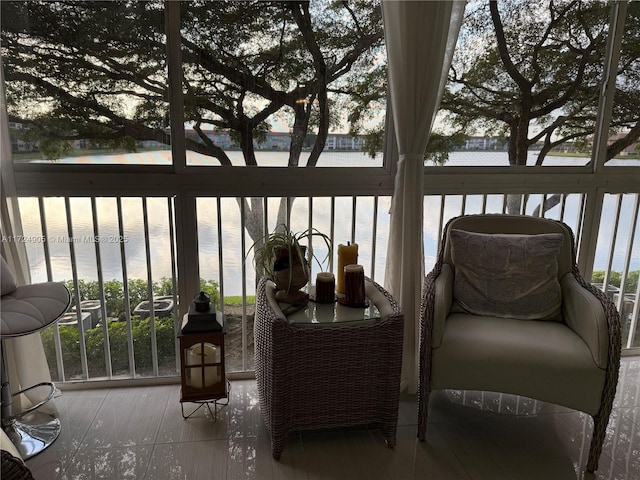 balcony featuring a water view