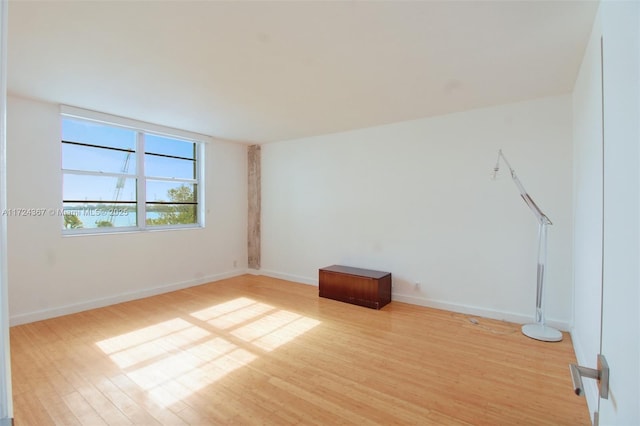 unfurnished room with light hardwood / wood-style flooring