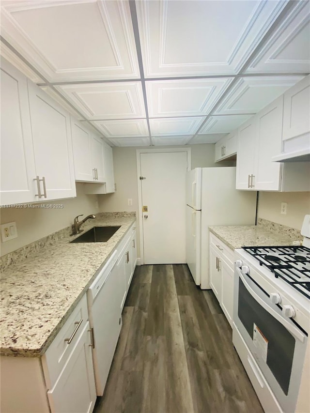 kitchen featuring dark hardwood / wood-style floors, white cabinetry, white appliances, and sink