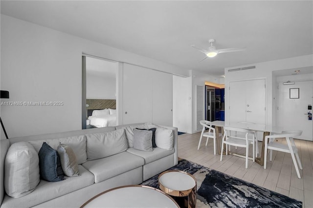 living room featuring ceiling fan