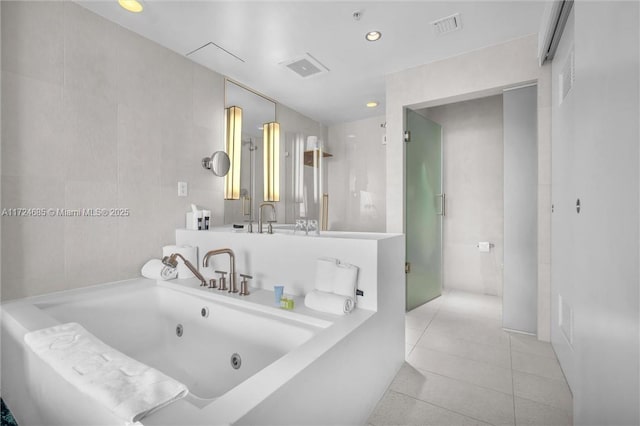 bathroom featuring tile patterned floors and a washtub