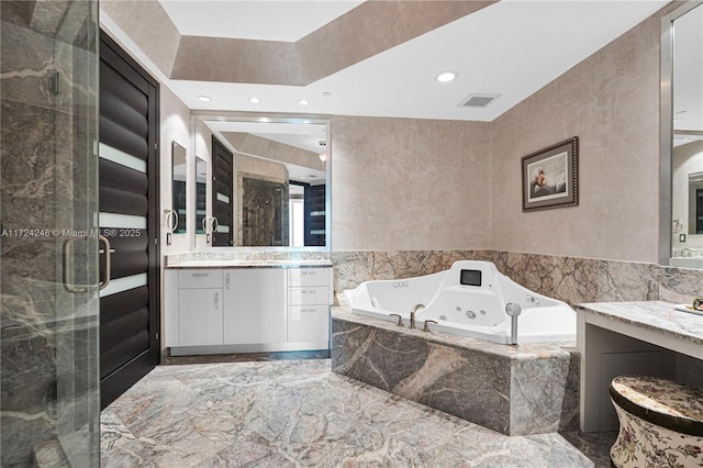 bathroom with separate shower and tub and vanity