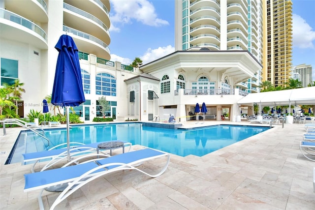 view of swimming pool featuring a patio