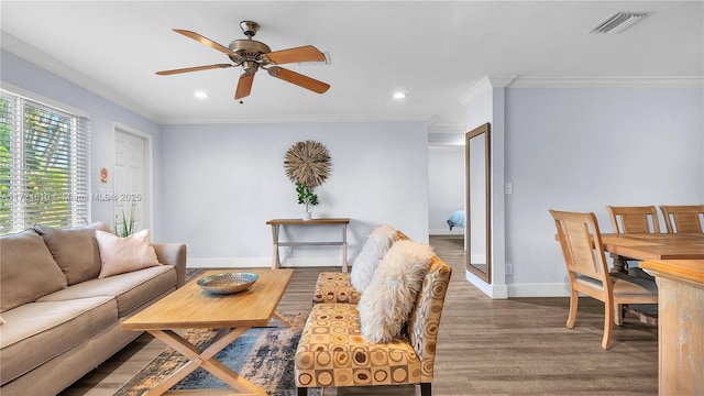 living room with ceiling fan, crown molding, and dark hardwood / wood-style flooring