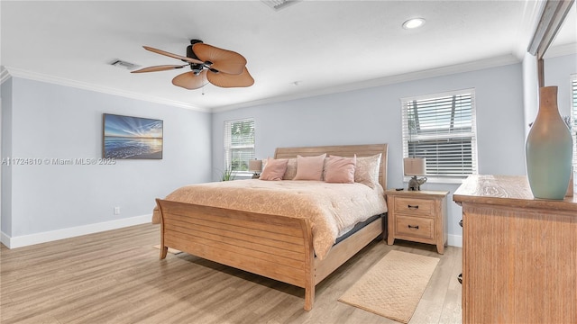 bedroom with ceiling fan, light wood-type flooring, and ornamental molding