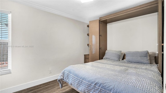 bedroom featuring wood-type flooring and ornamental molding