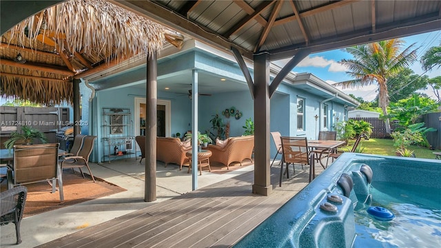 view of patio / terrace with a gazebo, ceiling fan, and an outdoor living space