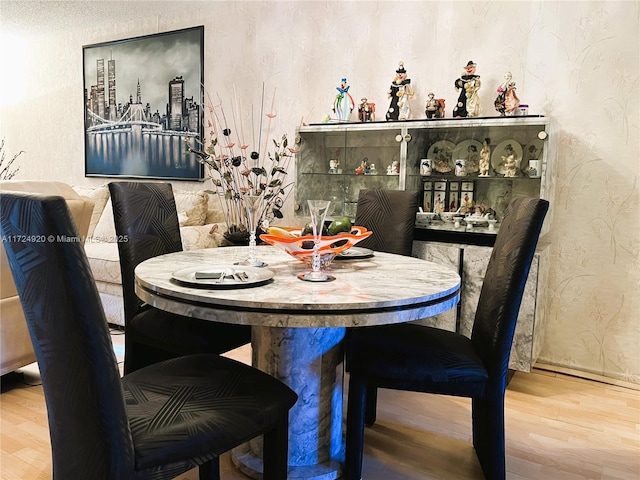 dining area with hardwood / wood-style floors