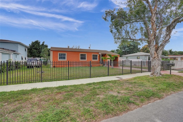 single story home featuring a front yard