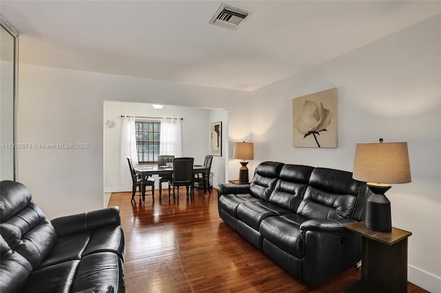 living room featuring dark hardwood / wood-style flooring