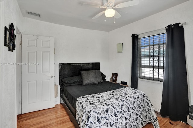 bedroom featuring ceiling fan and light wood-type flooring