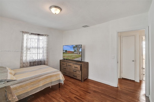 bedroom featuring dark wood-type flooring