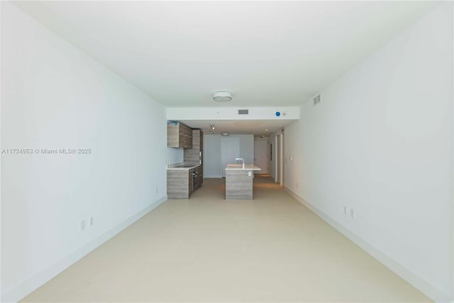 650 NE 32nd St Unit 2703, Miami, FL 33137 - unfurnished living room featuring baseboards