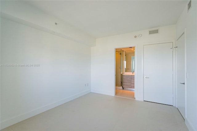 650 NE 32nd St Unit 2703, Miami, FL 33137 - unfurnished bedroom featuring baseboards and ensuite bath