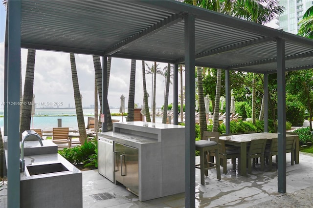 650 NE 32nd St Unit 2703, Miami, FL 33137 - view of patio featuring a pergola and a water view