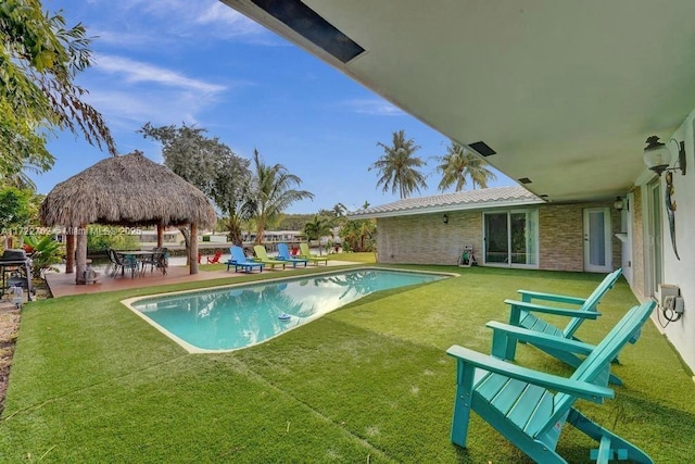 view of swimming pool with a gazebo, a yard, and a patio area