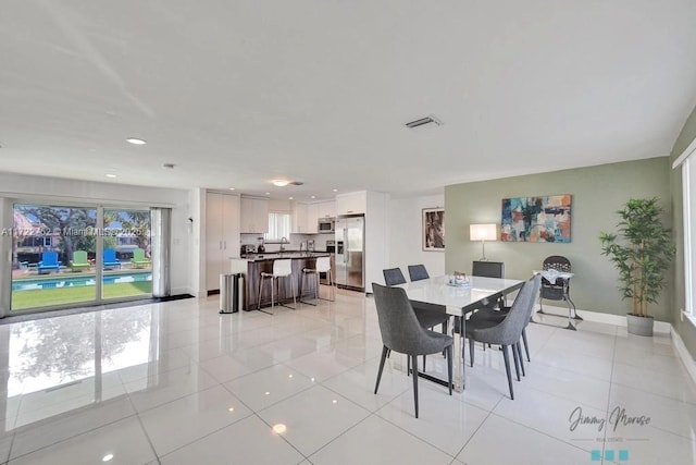 dining room with light tile patterned floors