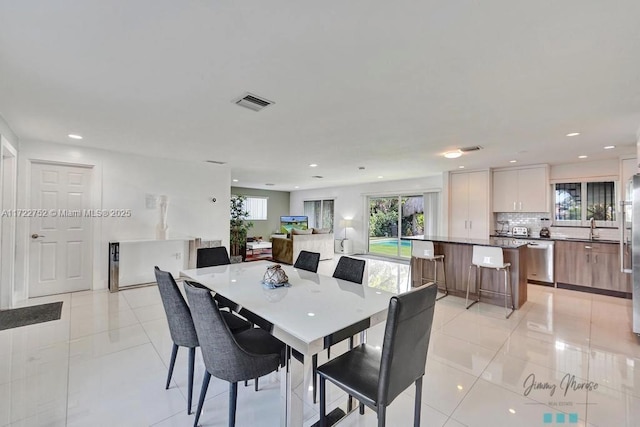 tiled dining space with sink