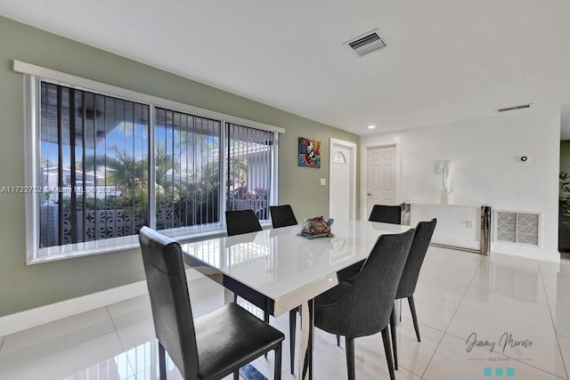 dining space featuring light tile patterned floors