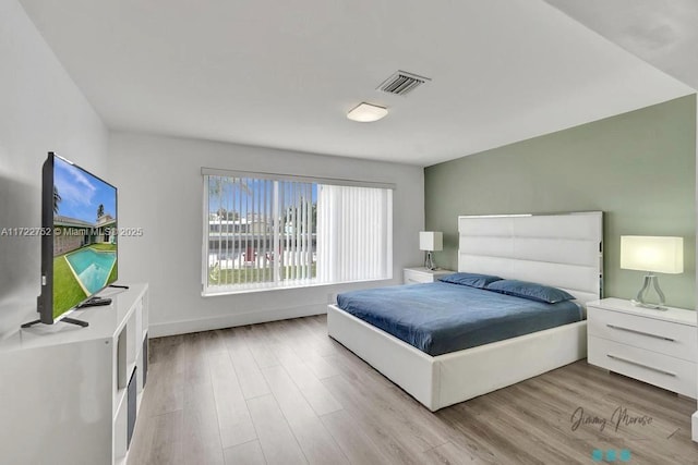 bedroom with light wood-type flooring