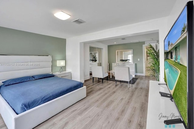 bedroom featuring light wood-type flooring