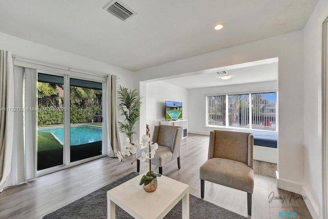 living room with light hardwood / wood-style flooring