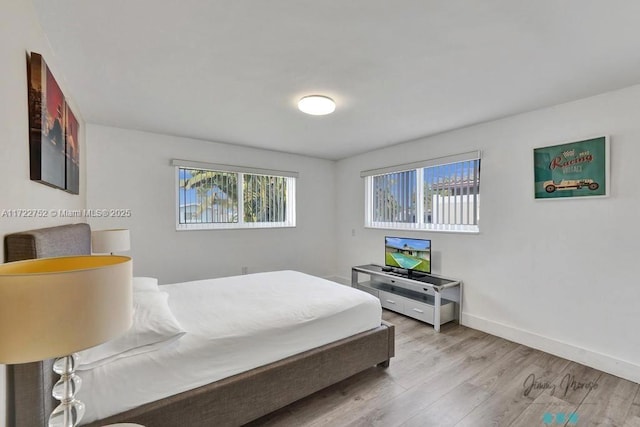 bedroom featuring light wood-type flooring