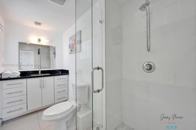 bathroom with vanity, toilet, and walk in shower