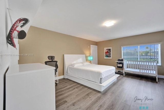 bedroom featuring hardwood / wood-style floors