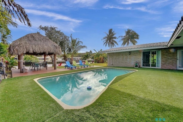 view of swimming pool with a gazebo, a lawn, and a patio