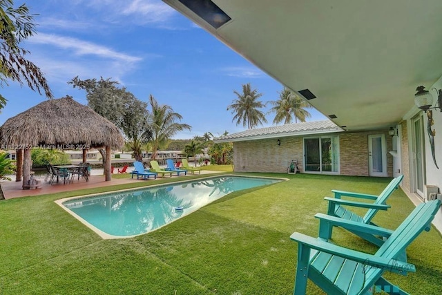 view of swimming pool featuring a gazebo and a yard