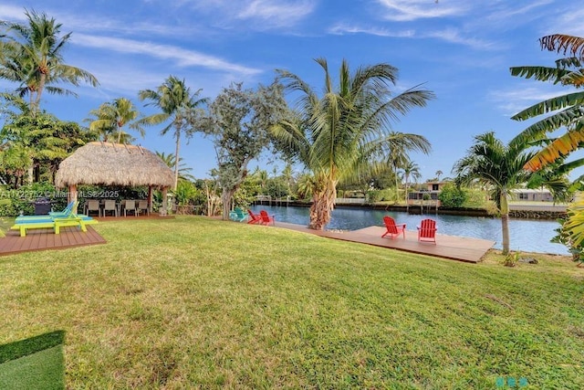 view of yard featuring a gazebo and a water view