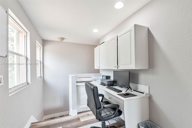 office area with light wood-type flooring