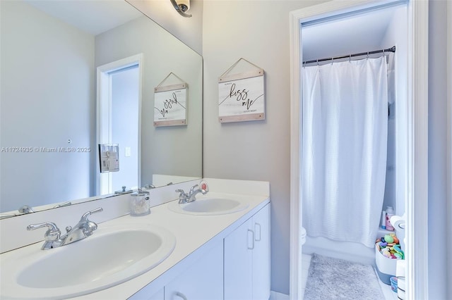 bathroom featuring vanity and toilet