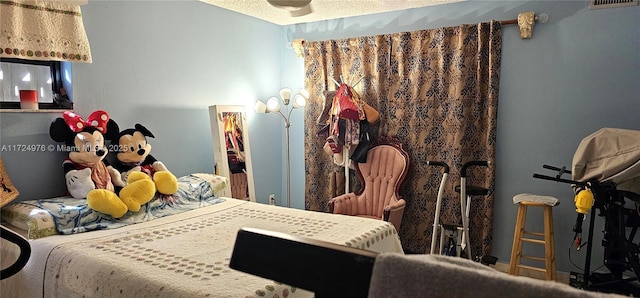 bedroom featuring a textured ceiling