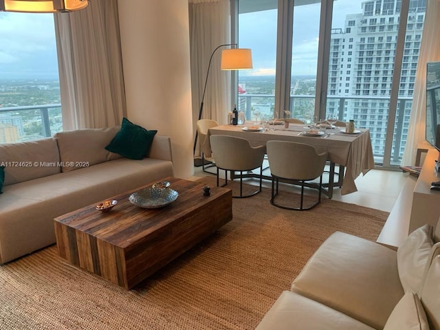 living room featuring floor to ceiling windows