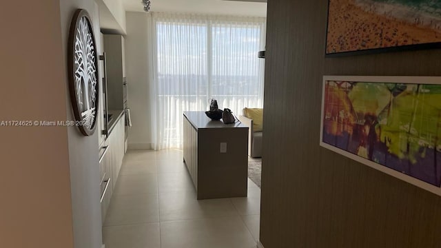 hallway with light tile patterned floors