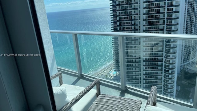 balcony featuring a water view